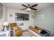 Charming bedroom featuring a modern ceiling fan and a cozy reading nook at 2113 N 66Th St, Scottsdale, AZ 85257