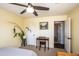 Comfortable bedroom with ceiling fan, desk, and a plant adding a touch of nature at 2113 N 66Th St, Scottsdale, AZ 85257