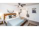 Stylish main bedroom with ceiling fan, a king bed, and soft natural light at 2113 N 66Th St, Scottsdale, AZ 85257