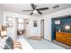 Relaxing main bedroom features ceiling fan, king bed, and multiple closets at 2113 N 66Th St, Scottsdale, AZ 85257