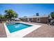 Backyard swimming pool featuring lounge chairs, manicured landscaping, and clear blue water at 2113 N 66Th St, Scottsdale, AZ 85257