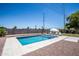 Inviting backyard pool with lounge seating and mature landscaping at 2113 N 66Th St, Scottsdale, AZ 85257