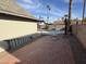 Brick patio, pool, and mature palm trees at 2221 S Saratoga Dr, Mesa, AZ 85202