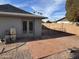 Brick patio and fenced backyard with gravel landscaping at 2221 S Saratoga Dr, Mesa, AZ 85202