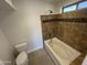 Updated bathroom with tile shower and bathtub at 2221 S Saratoga Dr, Mesa, AZ 85202