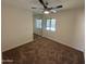 Bedroom with mirrored closet and pool view at 2221 S Saratoga Dr, Mesa, AZ 85202