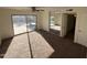 Main bedroom with carpeting, sliding glass doors to backyard and mirrored closet at 2221 S Saratoga Dr, Mesa, AZ 85202