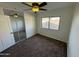 Bright bedroom with mirrored closet and ceiling fan at 2221 S Saratoga Dr, Mesa, AZ 85202