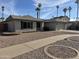 Attractive single-story home with a landscaped front yard and two-car garage at 2221 S Saratoga Dr, Mesa, AZ 85202