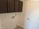 Laundry area with upper cabinets and hookups at 2221 S Saratoga Dr, Mesa, AZ 85202