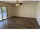 Living room with wood-look tile floors, sliding glass door to pool at 2221 S Saratoga Dr, Mesa, AZ 85202