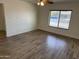 Living room with wood-look tile flooring and ceiling fan at 2221 S Saratoga Dr, Mesa, AZ 85202