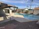 Inviting kidney-shaped pool in backyard at 2221 S Saratoga Dr, Mesa, AZ 85202