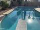 Inviting swimming pool with diving board, reflecting palm trees at 2221 S Saratoga Dr, Mesa, AZ 85202