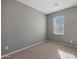 Well-lit bedroom featuring neutral walls and carpet at 2477 W Market Pl # 55, Chandler, AZ 85248