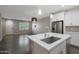 Modern kitchen with white cabinets, stainless steel appliances, and an island at 2477 W Market Pl # 55, Chandler, AZ 85248