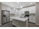 Modern kitchen with white cabinets, quartz countertops, and island at 2477 W Market Pl # 55, Chandler, AZ 85248