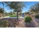 Community park with grassy area, trees, and playground at 2477 W Market Pl # 55, Chandler, AZ 85248