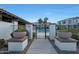 Gated entrance to community pool area with landscaping at 2477 W Market Pl # 55, Chandler, AZ 85248