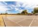 Well-maintained community basketball court with basketball hoop and expansive playing surface at 3129 W Fremont Rd, Phoenix, AZ 85041