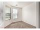 Bright bedroom with neutral carpet, white walls, and natural light from two windows with window blinds at 3129 W Fremont Rd, Phoenix, AZ 85041