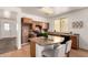 Well-appointed kitchen featuring wood cabinets, black appliances, and a functional center island at 3129 W Fremont Rd, Phoenix, AZ 85041