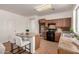 Bright kitchen featuring wood cabinets, black appliances, and a functional center island at 3129 W Fremont Rd, Phoenix, AZ 85041