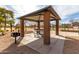 Shaded picnic area with a grill and seating, perfect for outdoor dining and gatherings at 3129 W Fremont Rd, Phoenix, AZ 85041