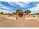 Colorful playground with slides and climbing features nestled in a sand-filled area at 3129 W Fremont Rd, Phoenix, AZ 85041