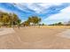 Community volleyball court with sand surface, net, and well-maintained surroundings at 3129 W Fremont Rd, Phoenix, AZ 85041