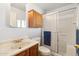 Bathroom with shower/tub combo and wood vanity at 3432 N 86Th Ave, Phoenix, AZ 85037