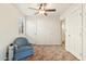 Bedroom with blue armchair and carpet flooring at 3432 N 86Th Ave, Phoenix, AZ 85037