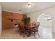 Bright dining area with brick fireplace and wood table at 3432 N 86Th Ave, Phoenix, AZ 85037