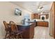 Kitchen with dark wood cabinets and granite countertops at 3432 N 86Th Ave, Phoenix, AZ 85037