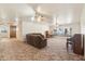 Living room with brown couch and built-in window seat at 3432 N 86Th Ave, Phoenix, AZ 85037