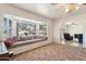 Living room featuring bay window, built-in seat, and piano at 3432 N 86Th Ave, Phoenix, AZ 85037