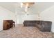 Living room with large sectional couch and piano at 3432 N 86Th Ave, Phoenix, AZ 85037