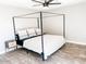 Bedroom with a canopy bed and wood nightstands at 356 Ancora W Dr, Litchfield Park, AZ 85340