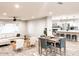 Open concept dining area with a wooden table and gray chairs at 356 Ancora W Dr, Litchfield Park, AZ 85340