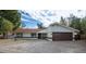 Single-story home with brown roof and a paved driveway at 356 Ancora W Dr, Litchfield Park, AZ 85340