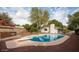 Inviting kidney-shaped pool with a diving board in the backyard at 356 Ancora W Dr, Litchfield Park, AZ 85340