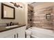 Bathroom with wood-look tile and a bathtub at 4213 E Stanford Ave, Gilbert, AZ 85234