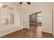 Well-lit bedroom with wood floors and access to other rooms at 4213 E Stanford Ave, Gilbert, AZ 85234