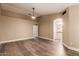 Spacious bedroom with wood-look floors and ceiling fan at 4213 E Stanford Ave, Gilbert, AZ 85234