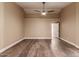 Bright bedroom featuring hardwood floors and ceiling fan at 4213 E Stanford Ave, Gilbert, AZ 85234