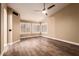 Bright bedroom with wood floors and a ceiling fan at 4213 E Stanford Ave, Gilbert, AZ 85234