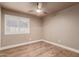 Charming bedroom with wood-look floors and plantation shutters at 4213 E Stanford Ave, Gilbert, AZ 85234