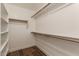 Large walk-in closet with ample shelving and hanging space at 4213 E Stanford Ave, Gilbert, AZ 85234