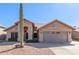 Single-story house with a two-car garage and desert landscaping at 4213 E Stanford Ave, Gilbert, AZ 85234