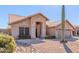 Single-story house with a two-car garage and a saguaro cactus at 4213 E Stanford Ave, Gilbert, AZ 85234